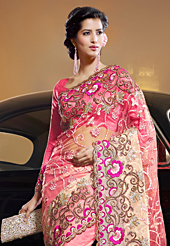 It is color this season and bright shaded suits are really something that is totally in vogue. This shaded pink and cream net saree have beautiful embroidery patch work which is embellished with resham, zari and stone work. Fabulous designed embroidery gives you an ethnic look and increasing your beauty. Matching blouse is available. Slight Color variations are possible due to differing screen and photograph resolutions.
