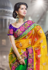 Exquisite combination of color, fabric can be seen here. This yellow and green net saree have beautiful embroidery patch work which is embellished with resham, zari and stone work. Fabulous designed embroidery gives you an ethnic look and increasing your beauty. Contrasting purple blouse is available. Slight Color variations are possible due to differing screen and photograph resolutions.