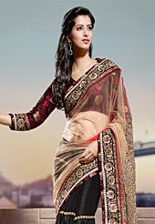 Ultimate collection of embroidery sarees with fabulous style. This fawn and black net saree have beautiful embroidery patch work which is embellished with zari, sequins and beads work. Fabulous designed embroidery gives you an ethnic look and increasing your beauty. Matching black and maroon blouse is available. Slight Color variations are possible due to differing screen and photograph resolutions.