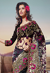 Your search for elegant look ends here with this lovely saree. This shaded black and grey net saree have beautiful embroidery patch work which is embellished with resham, zari and stone work. Fabulous designed embroidery gives you an ethnic look and increasing your beauty. Matching blouse is available. Slight Color variations are possible due to differing screen and photograph resolutions.