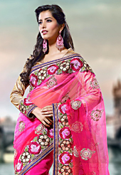 Dreamy variation on shape and forms compliment your style with tradition. This shaded pink net saree have beautiful embroidery patch work which is embellished with resham and stone work. Fabulous designed embroidery gives you an ethnic look and increasing your beauty. Contrasting beige blouse is available. Slight Color variations are possible due to differing screen and photograph resolutions.