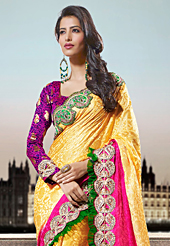 The fascinating beautiful subtly garment with lovely patterns. This yellow and pink crepe jacquard saree have beautiful embroidery patch work which is embellished with zari and beads work. Fabulous designed embroidery gives you an ethnic look and increasing your beauty. Contrasting blue and dark magenta blouse is available. Slight Color variations are possible due to differing screen and photograph resolutions.