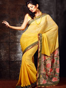•Looks adorable in this summer sensation yellow shade saree. 
•Saree features subtle floral patterns. 
•Lower part of the pallu is a net patch, embellished with colorful floral thread work. 
•A fancy border frames the saree. 
•Faux georgette saree.
•Design, Colors and patterns on the actual product may slightly vary from designs shown in the image. Images are only representative