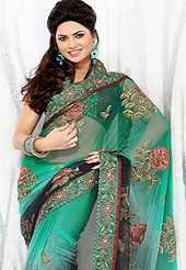 Be the cynosure of all eyes with this exquisite range of party wear sarees in flattering colors and combinations. This collection of Net Sarees ,flaunt your feminine grace and glamour in this smart and classic wear collection of sarees. Designer  Saree in material  with net embellished  with heavy embroidery  work all over the saree and  embroidered lace on border. Slight Color variations possible due to differing screen and photograph resolutions.