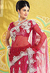The traditional patterns used on this saree maintain the ethnic look. Red lehanga style saree make you contemporary look. This Drape has a beautiful and heavy handwork of stone, zari and Cerovski. This Net saree have an awesome color combination and matching designer blouse. Slight color variations possible due to differing screen and photograph resolution. 