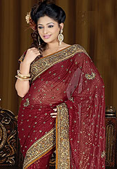 Ultimate collection designer shimmer georgette saree work with  heavy embroidered border and butti work give a fabulous style. This saree is embellished with stone, beads, sequins and resham work.  This saree is available on different colors- Pink, Orange, Green, Magenta with matching blouse. Slight Color variations possible due to differing screen and photograph resolutions.