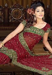 Explore your feminine self with this surprising saree. The main distinct feature of the saree is that it is made up of shimmer georgette that makes the saree totally unique from all others. The saree is suitable for parties and events. This saree is embellished with embroidered work. This saree is available on different different colors like- Magenta, Sky Blue, Peach, and Yellow with matching blouse. Slight Color variations possible due to differing screen and photograph resolutions.
