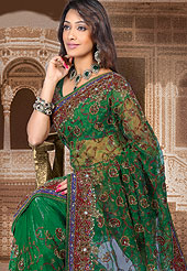 Outfit is a novel ways of getting yourself noticed. Tryout this season maroon embroidery saree which is beautified with Sequins, stone, zari, resham work. Saree have urban foliage pattern on pallu which gives a pretty look and grave border increasing beauty of saree. Matching designer blouse is available. This saree also available in Mustard-green, Red-purple, Purple-green, Pink-blue  colors. Slight Color variations are possible due to differing screen and photograph resolutions.