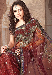Outfit is a novel ways of getting yourself noticed. Tryout this season Rust embroidery saree which is beautified with Sequins, stone, zari, resham work. Saree have urban foliage pattern on pallu which gives a pretty look and lace border increasing beauty of saree. Matching designer blouse is available. This saree is also available in Purple, Turquoise green, Peacock blue, Mustard, Navy blue colors. Slight Color variations are possible due to differing screen and photograph resolutions.