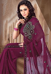 Try out this year top trends, glowing, bold and natural collection. This Burgundy saree embellished with resham and sitara work. Border is nicely designed with sequence and stone. Pallu have also nice embroidered floral pattern. It’s cool and has a very modern look to impress all. Matching blouse is available.  This saree is also available in Olive green, Brown, Grey, Violet colors. Slight Color variations are possible due to differing screen and photograph resolutions.