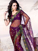 Try out this year top trends, glowing, bold and natural collection. This purple tissue saree is beautifully crafted with resham, cutdana, zari and stone work. As shown blouse can be made possible and also can be customized as per your style subject to fabric limitation.  Slight color variations are possible due to differing screen and photograph resolution.