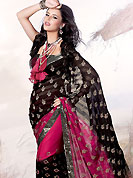 Welcome to the new era of Indian fashion wear. This black and magenta faux georgette saree is beautifully adorned with resham, zari, sequins and patch work in floral patterns. As shown blouse can be made possible and also can be customized as per your style subject to fabric limitation.  Slight color variations are possible due to differing screen and photograph resolution.