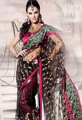 You can be sure that ethnic fashions selections of clothing are taken from the latest trend in today’s fashion. This black and magenta net saree is beautifully adorned with resham, zari, cutdana and patch work in floral patterns. As shown blouse can be made possible and also can be customized as per your style subject to fabric limitation.  Slight color variations are possible due to differing screen and photograph resolution.
