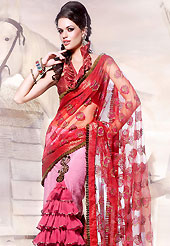 The popularity of this dress comes from the fact that it showcases the beauty modesty as well as exquisitely. This red and pink net lehenga style and jacquard saree is beautifully encrafted with resham, zari, stone and patch work in floral patterns. As shown blouse can be made possible and also can be customized as per your style subject to fabric limitation.  Slight color variations are possible due to differing screen and photograph resolution.