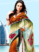 It is color this season and bright shaded saree are really something that is totally in vogue. This saree simply designed with stylish and amazing abstract and floral print pattern which made it attractive and unique to others. Border of saree is nicely designed with print work. The saree is specially crafted for your stunning look and terrific style with this matching blouse. This saree made with georgette fabric. Slight Color variations are possible due to differing screen and photograph resolutions.