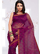 Breathtaking collection of sarees with stylish print work and fabulous style. This magenta net printed casual wear saree have floral butti print on all over the saree. Border has amazing contrasting fabric lace. It’s cool and has a very modern look to impress all. Matching blouse is available.  Slight Color variations are possible due to differing screen and photograph resolutions.