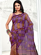 The popularity of this dress comes from the fact that it showcases the beauty modesty as well as exquisitely. This violet and yellow net printed casual wear saree have beautiful floral and block print work on all over. Border has amazing contrasting fabric lace. It’s cool and has a very modern look to impress all. Matching blouse is available.  Slight Color variations are possible due to differing screen and photograph resolutions.