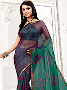 You can be sure that ethnic fashions selections of clothing are taken from the latest trend in today’s fashion. This turquoise net printed casual wear saree have beautiful floral and geometrical art print work on all over. Border has amazing contrasting fabric lace. It’s cool and has a very modern look to impress all. Matching blouse is available.  Slight Color variations are possible due to differing screen and photograph resolutions.