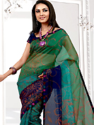Era with extension in fashion, style, Grace and elegance have developed grand love affair with this ethnical wear. This blue net printed casual wear saree have beautiful floral print work on all over. Border has amazing contrasting fabric lace. It’s cool and has a very modern look to impress all. Matching blouse is available.  Slight Color variations are possible due to differing screen and photograph resolutions.