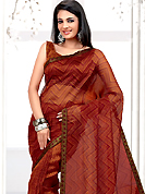 Bold colors created by the inventive drapes of textile catch the imagination like no other contemporary clothing. This Rust net printed casual wear saree have beautiful zigzag and paisley print work on all over. Border has amazing contrasting fabric lace. It’s cool and has a very modern look to impress all. Matching blouse is available.  Slight Color variations are possible due to differing screen and photograph resolutions.