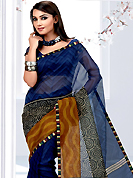Attract all attentions with this printed saree. This blue net printed casual wear saree have beautiful geometrical art print work on all over. Border has amazing contrasting fabric lace. It’s cool and has a very modern look to impress all. Matching blouse is available.  Slight Color variations are possible due to differing screen and photograph resolutions.
