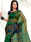 Take the fashion industry by storm in this beautiful printed saree. This green and blue net printed casual wear saree have beautiful floral and dots print work on all over. Border has amazing contrasting fabric lace. It’s cool and has a very modern look to impress all. Matching blouse is available.  Slight Color variations are possible due to differing screen and photograph resolutions.