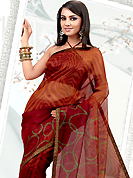 Let your personality articulate for you with this amazing printed saree. This red and orange net printed casual wear saree have beautiful abstract and geometrical art print work on all over. Border has amazing contrasting fabric lace. It’s cool and has a very modern look to impress all. Matching blouse is available.  Slight Color variations are possible due to differing screen and photograph resolutions.