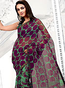 Style and trend will be at the peak of your beauty when you adorn this saree. This purple and pastel green net printed casual wear saree have beautiful floral and polka dots print work on all over. Border has amazing contrasting fabric lace. It’s cool and has a very modern look to impress all. Matching blouse is available.  Slight Color variations are possible due to differing screen and photograph resolutions.