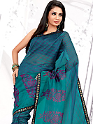 Elegance and innovation of designs crafted for you. This light blue net printed casual wear saree have beautiful floral butta and lines print work on all over. Border has amazing contrasting fabric lace. It’s cool and has a very modern look to impress all. Matching blouse is available.  Slight Color variations are possible due to differing screen and photograph resolutions.