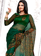 Envelope yourself in classic look with this charming saree. This green net printed casual wear saree have beautiful floral print work on all over. Border has amazing contrasting fabric lace. It’s cool and has a very modern look to impress all. Matching blouse is available.  Slight Color variations are possible due to differing screen and photograph resolutions.