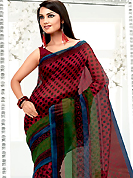 This season dazzle and shine in pure colors. This red net printed casual wear saree have beautiful polka dots print work on all over. Border has amazing contrasting strips in swirls print work. It’s cool and has a very modern look to impress all. Matching blouse is available.  Slight Color variations are possible due to differing screen and photograph resolutions.