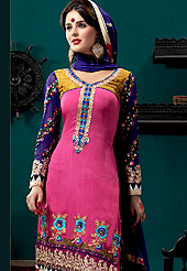 Fantastic georgette suit embellished with embroidery with matching churidar and dupatta. Amazing kameez adorned with resham floral patch work on bottom and fabric lace. Beautiful embroidery on neckline and sleeves. Back of kameez is printed. Combination of colors and embroidery border made very pretty and enhanced your personality. Outfit is a novel ways of getting yourself noticed. A matching churidar and embellished dupatta is available. Slight color variations are possible due to differing screen and photograph resolutions.