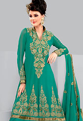 Take the fashion industry by storm in this lovely green churidar suit. The floral embroidery done with stone and zari work on kameez creates a stunning touch and adds to the elegance of the entire suit. This suit is made with georgette fabric. Matching dupatta and churidar gives a perfect finish to the entire suit. Slight Color variations are possible due to differing screen and photograph resolutions.