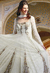 The popularity of this dress comes from the fact that it showcases the beauty modesty as well as exquisitely.  This anarkali suit has a wonderful embroidered kameez which is designed with urban floral patch work done with zari, reshams and sequins in bottom area. Stylish and beautiful pattern on choli is eye-catching and gives a pretty look. This drape material is net with inner. Matching churidar and embroidered dupatta is available. Slight color variations are possible due to differing screen and photograph resolutions.