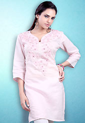 This Light Pink Readymade Indo Western Tunic. This tunic is nicely designed with floral embroidery work done with cotton thread. This is perfect casual wear readymade tunics. This is made with linen cotton fabric. Slight color variations are possible due to differing screen and photograph resolution.