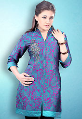 This Turquoise and Pink Readymade Indo Western Tunic. This tunic is nicely designed with floral embroidery work done with cotton thread. This is perfect casual wear readymade tunics. This is made with linen cotton fabric. Slight color variations are possible due to differing screen and photograph resolution.