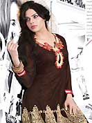 Attract all attentions with this embroidered kurti. This beautiful designer dark brown net readymade tunic have amazing embroidery patch work is done with resham work. The entire ensemble makes an excellent wear. This is a perfect patry wear readymade kurti. Accessories shown in the image is just for photography purpose. Slight Color variations are possible due to differing screen and photograph resolutions.